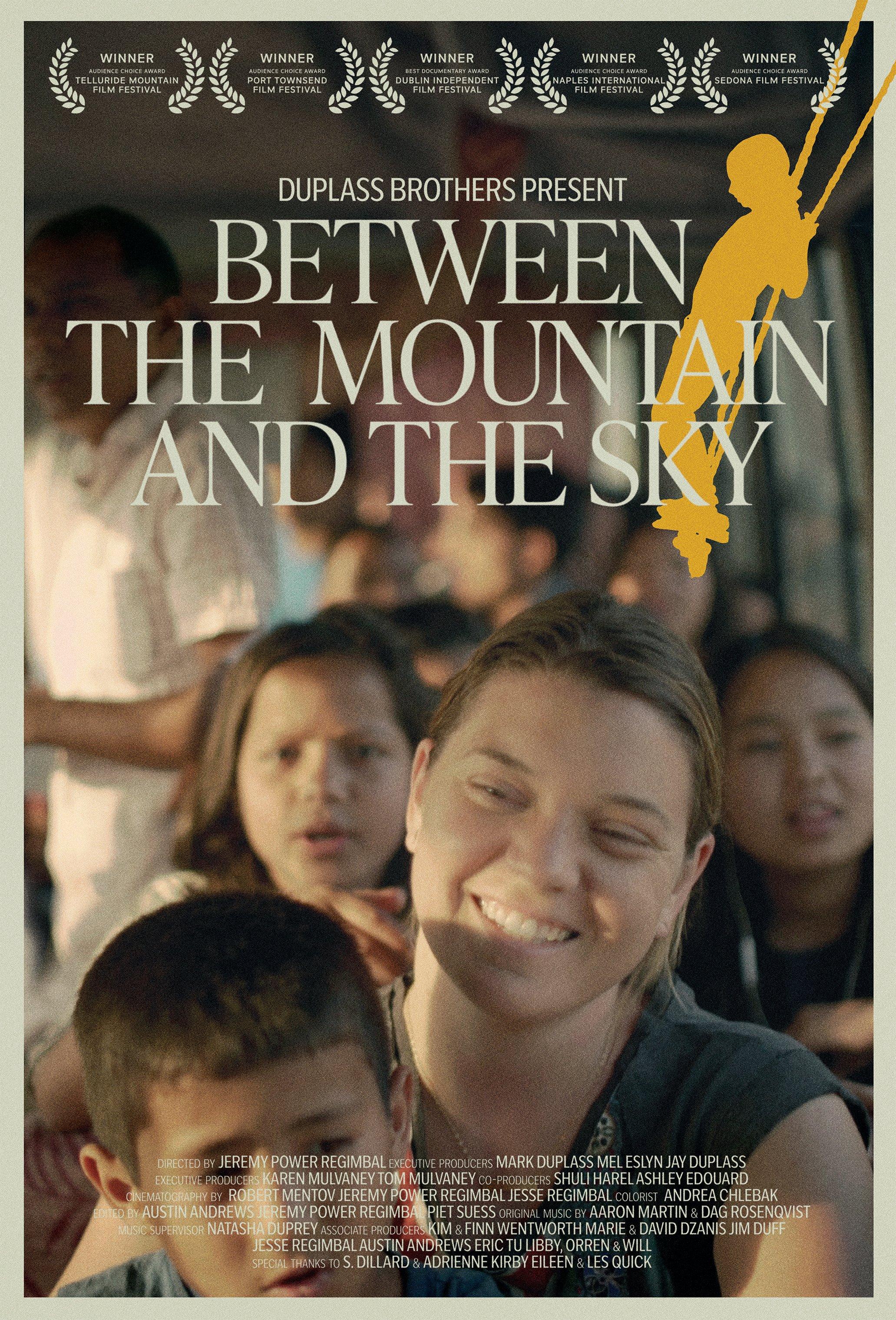 A movie poster showing the smiling face of woman surrounded by children on a bus
