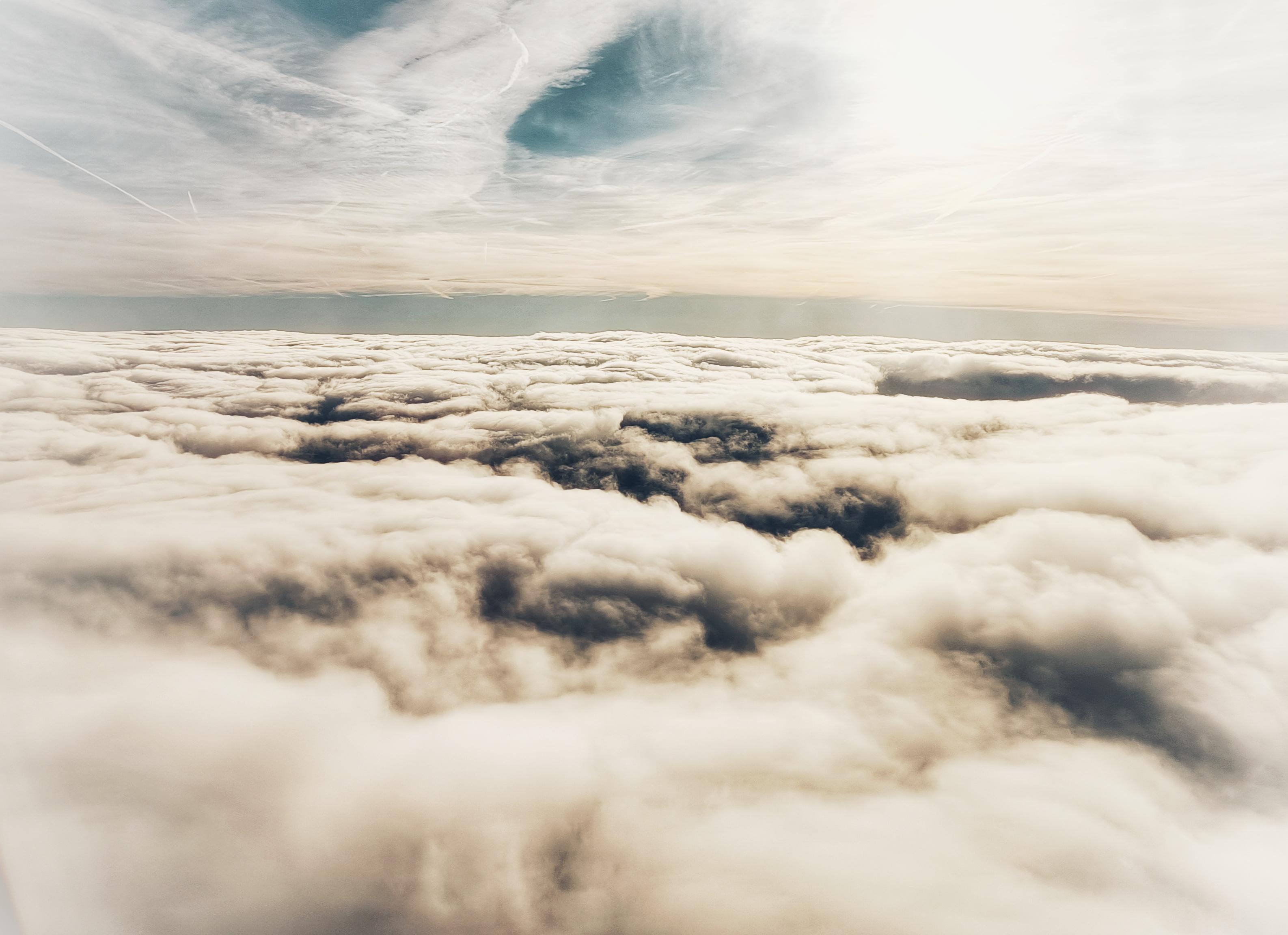 A view out of an airplane window showing clouds.